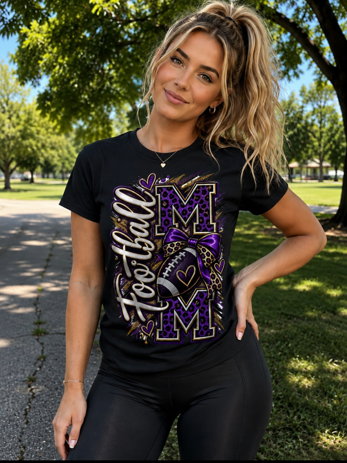 Football Mom white graphic tee with navy and orange bow design worn at stadium
